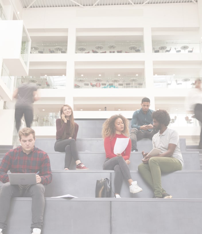 Group of employees & students working on steps